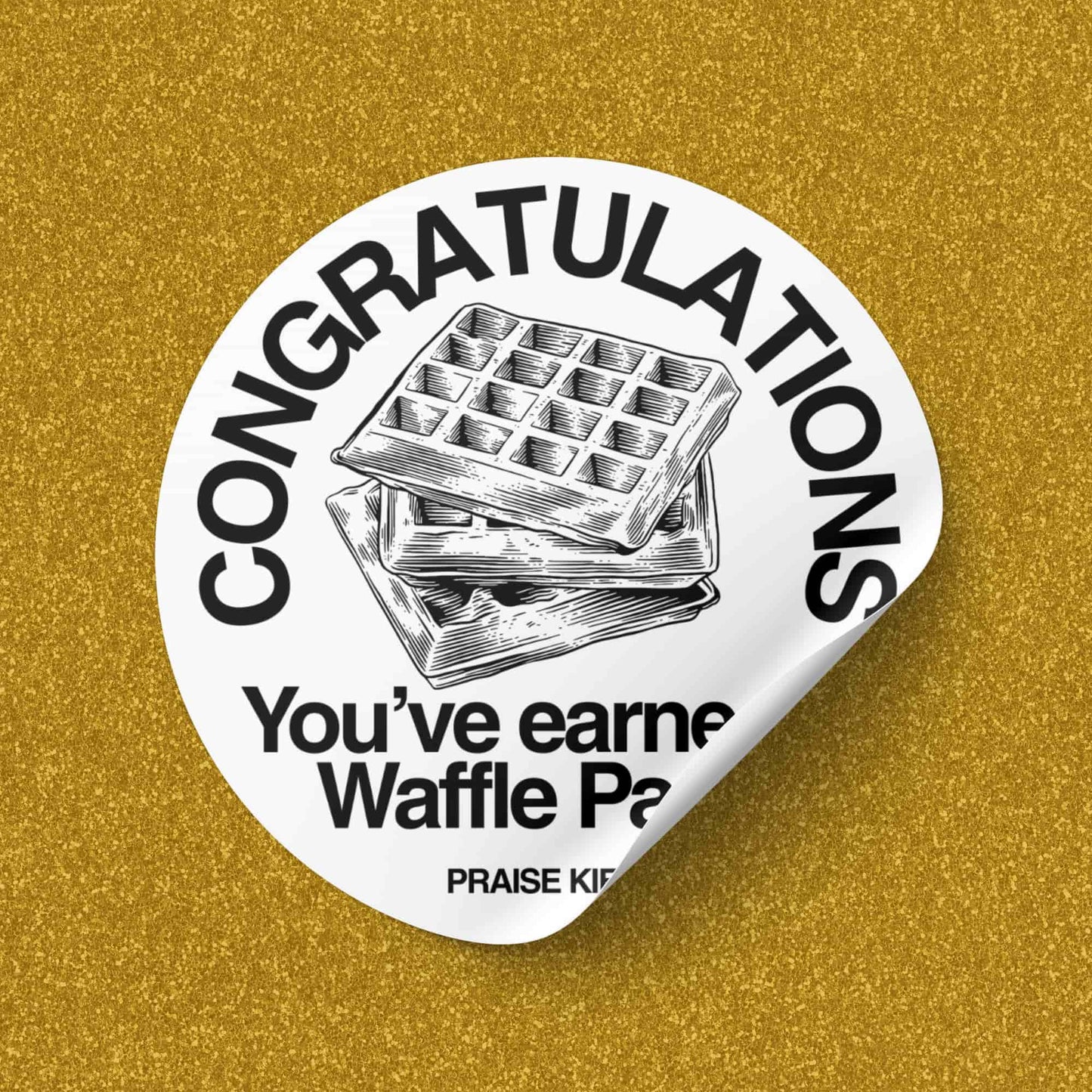 Sticker reading “Congratulations, you’ve earned a Waffle Party. Praise Kier.” with an illustration of stacked waffles on a glittery gold background, referencing the show Severance.